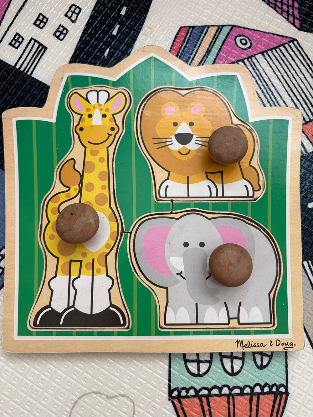 Melissa & Doug Wooden Animal Peg Puzzle - Green with Yellow, Brown, Pink, Gray.